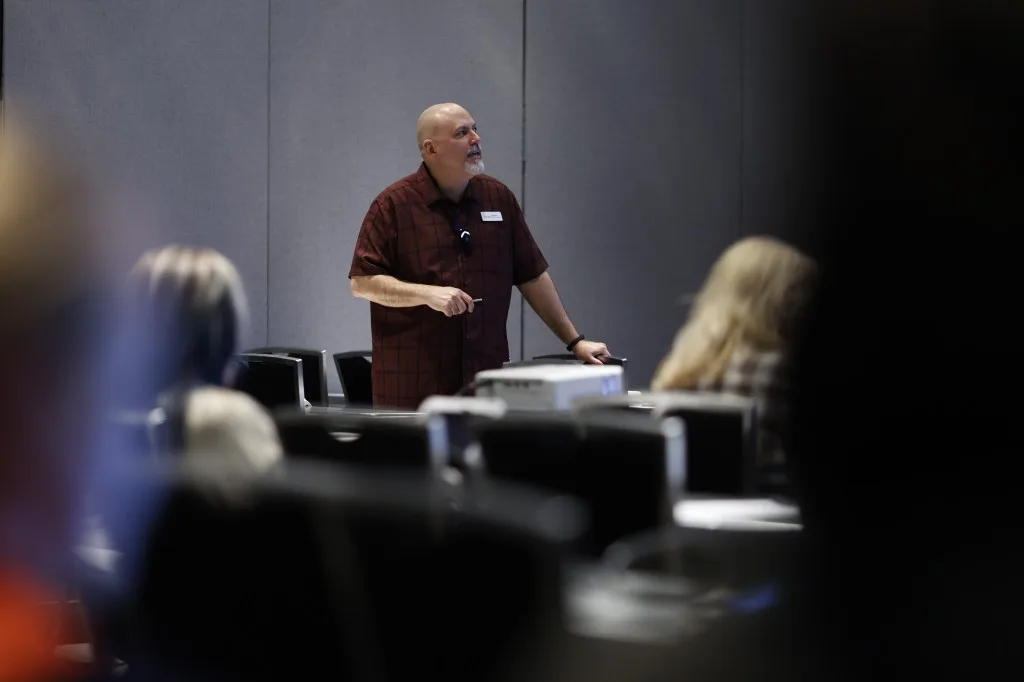 A shot of me presenting at the session below.