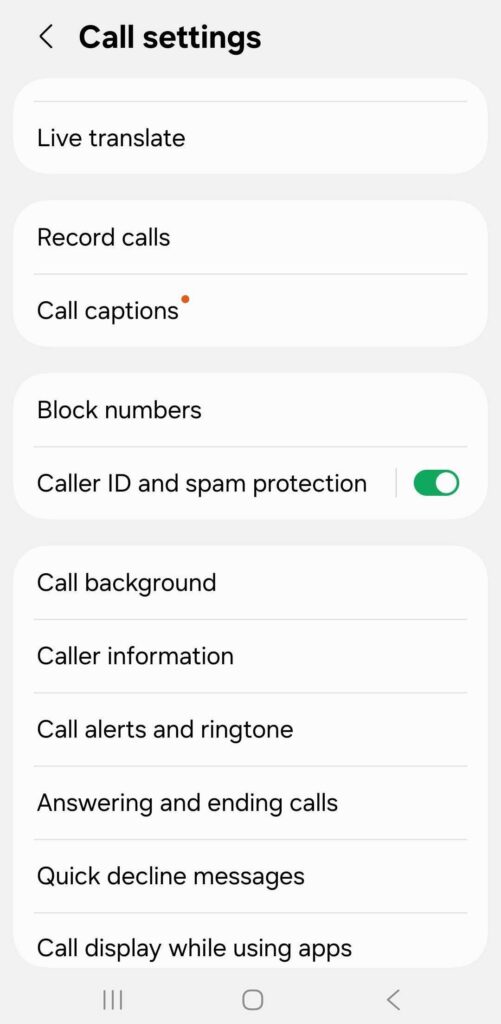 An Android Call settings screen listing Live translate, Record calls, Call captions, Block numbers, and "Caller ID and spam protection" with its toggle switched on, followed by call background, caller information, call alerts and ringtone, and answering options.