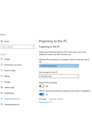 Windows 10 Settings on the "Projecting to this PC" page, with availability set to "Available everywhere", "Ask to project to this PC" set to "First time only", PIN pairing off and discovery on while plugged in.